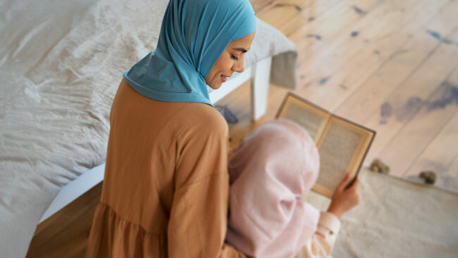Mother daughter reciting Quran