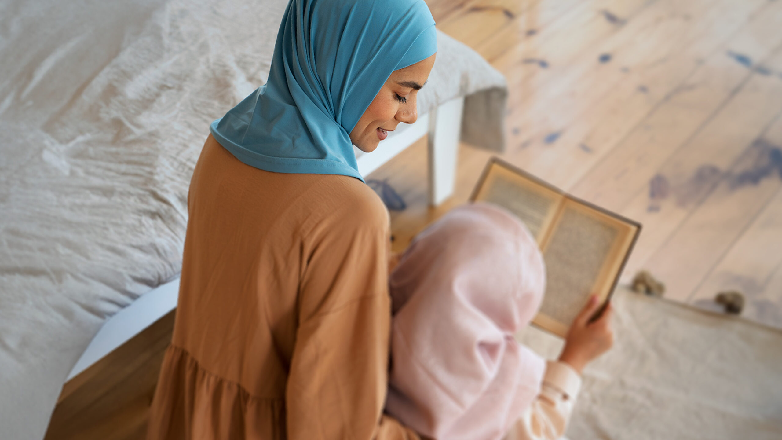 Mother daughter reciting Quran Mother daughter reciting Quran