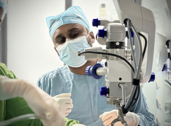 Dr Azzam doing laser surgery