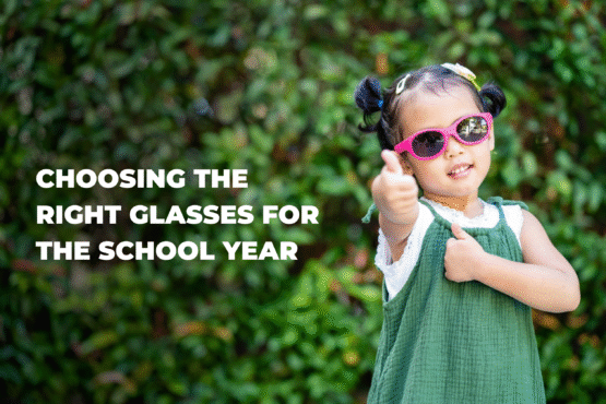 Choosing the Right Glasses for the School Year A child trying on eyeglasses while a parent assists, highlighting comfort, fit, and style for the school year